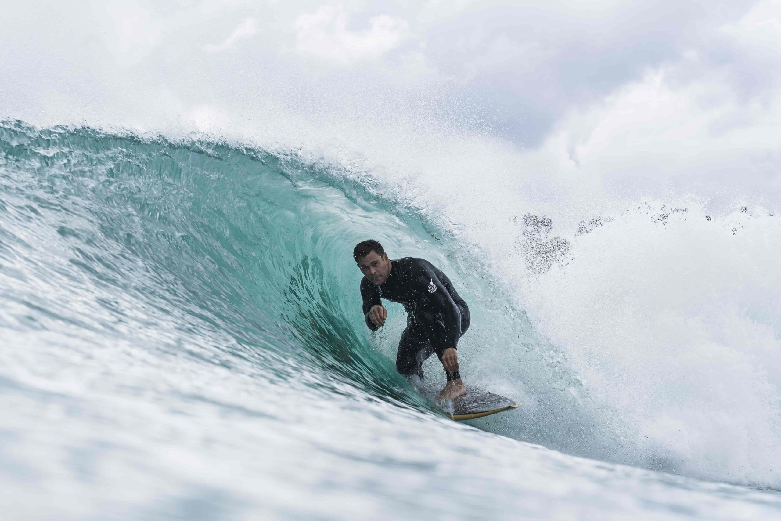 Chris Hemsworth gets tubed at surf lakes